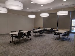 Image of Gathering Place room A divided set up with four chairs per table