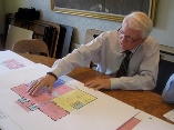 An architect draws up plans for the new building