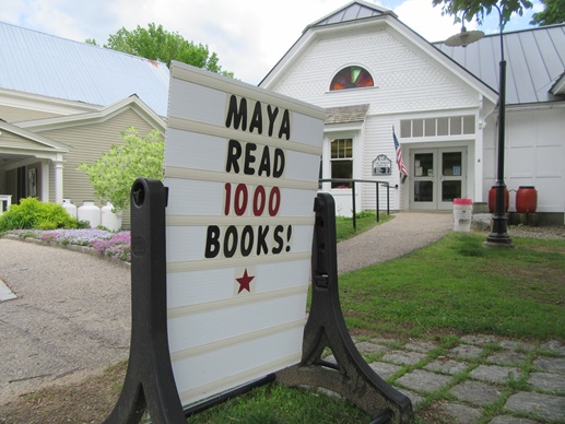 photo of library roadside sign with words "Maya read 1,000 books!"