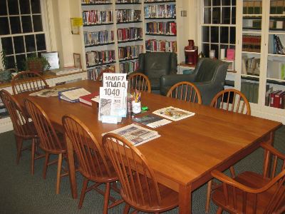 Image of the Library's upstairs meeting area with table and chairs