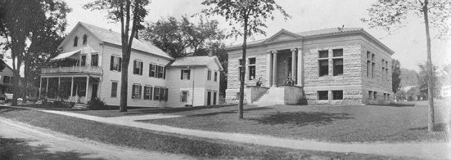 Vintage photograph of Main St. with  Porter/Mayer House next to Meekins Library