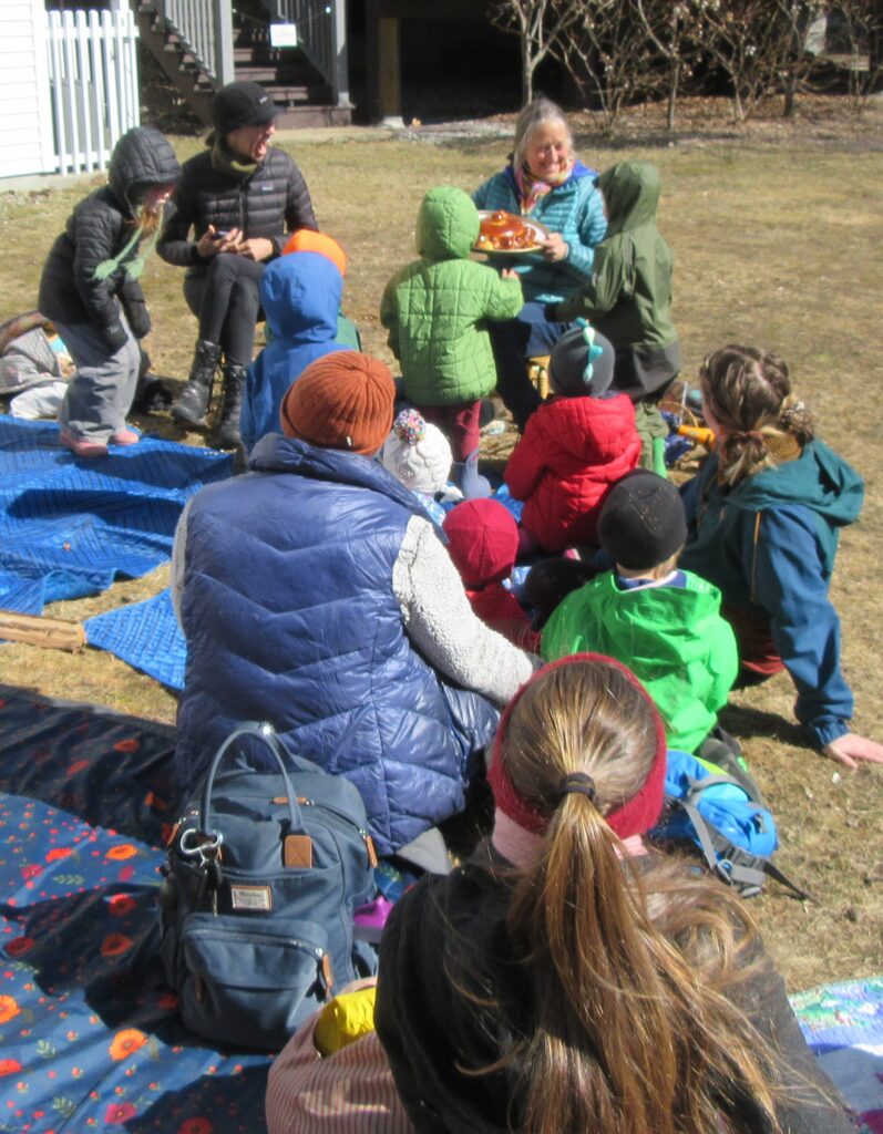 photo of kids and librarians at outdoor storytime