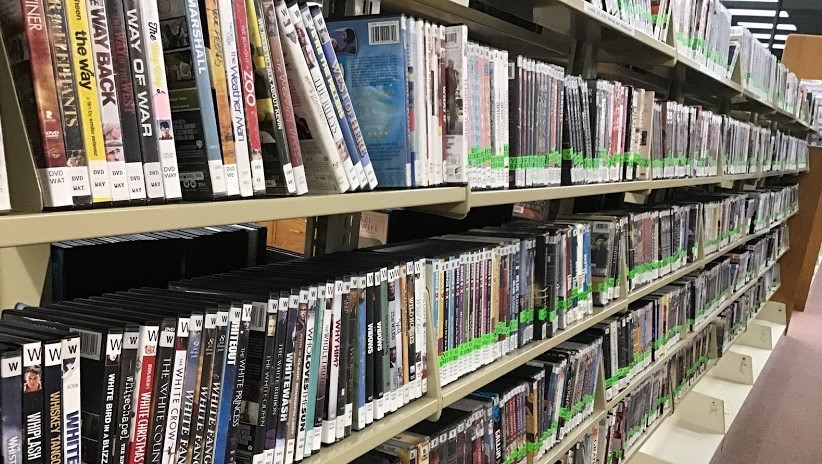 a shelf of DVDs