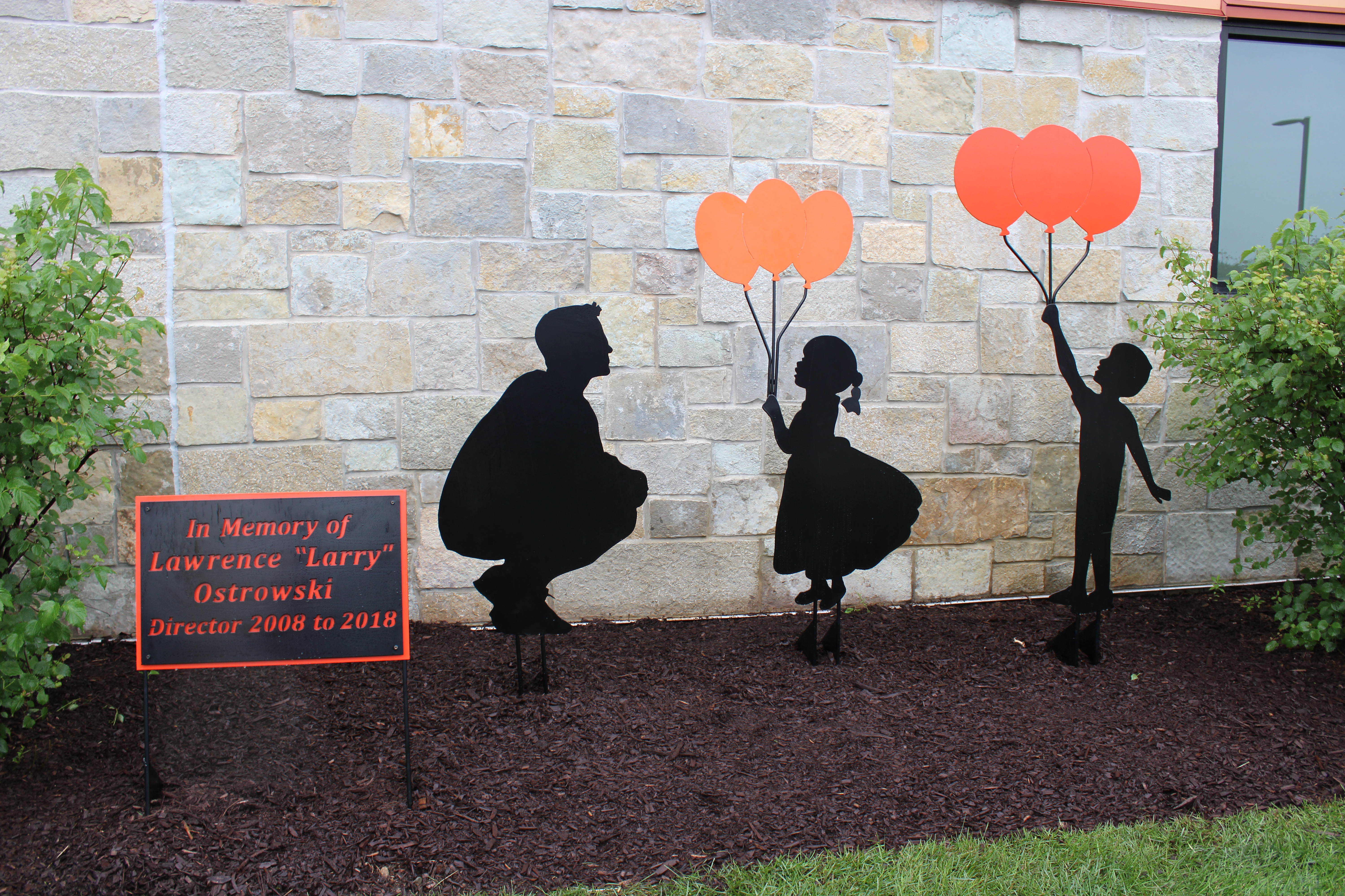 Image of memorial sculpture installation honoring former Library Director Larry Ostrowski